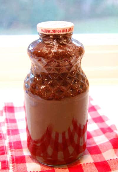 iced coffee liquid concentrate, A glass jar full of coffee concentrate and steeping the coffee in water