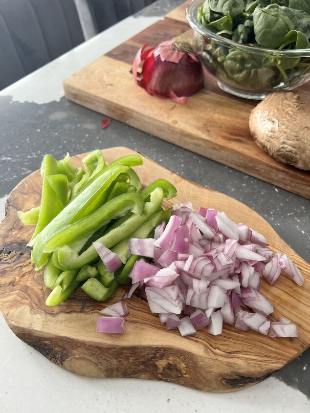 a healthy winter vegetable soup recipe, Chopped green peppers and onions on a wood cutting board