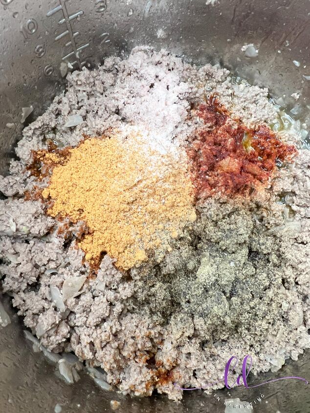 easy instant pot taco macaroni recipe, Add Seasonings to Beef to Make Easy Instant Pot Taco Macaroni