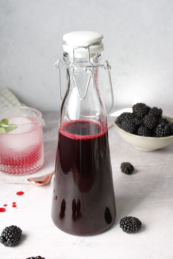 blackberry simple syrup, blackberry simple syrup in a tall glass bottle