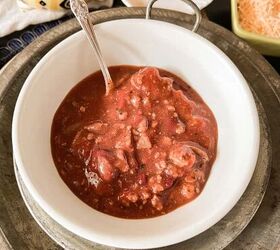 Easy Winter Chili recipe served with sour cream shredded cheese and sweet corn bread muffins