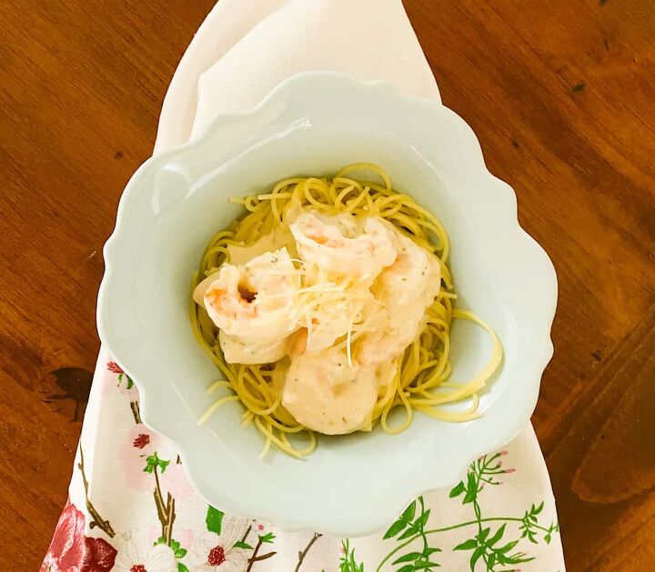 the best traditional italian pasta sauce, Easy Shrimp Alfredo with Angel Hair Pasta in a bowl on a floral napkin on the table