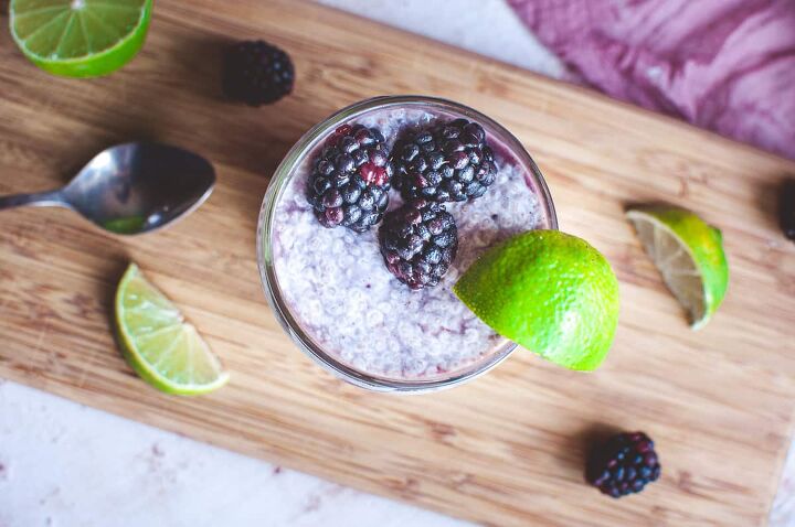 blackberry lime chia seed wellness parfait, chia seed parfait garnished with a lime wedge