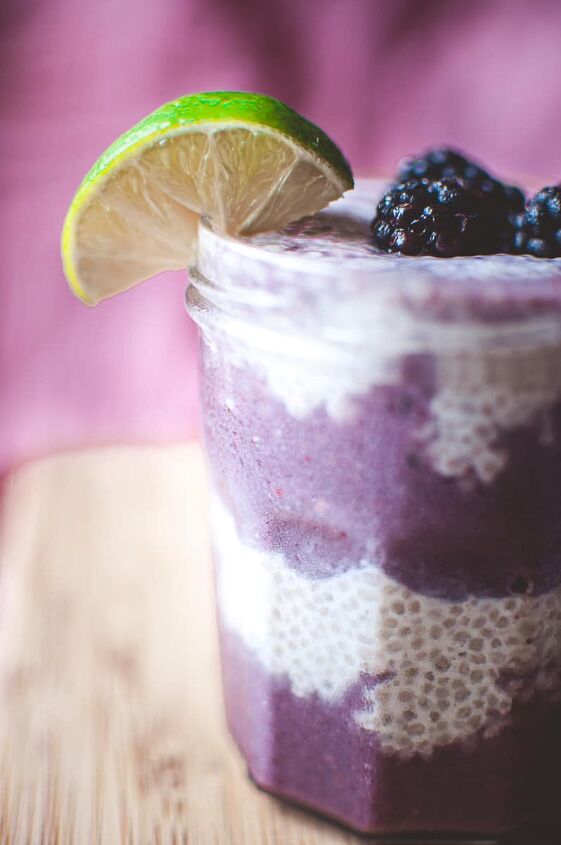 blackberry lime chia seed wellness parfait, a close up shot of layers of a chia seed parfait