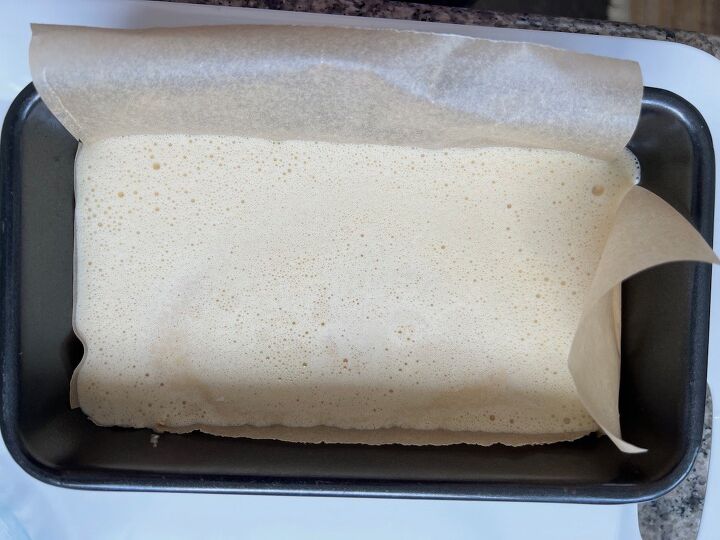 easy cassava bread no yeast, Cassava bread batter in a parchment lined loaf pan before baking