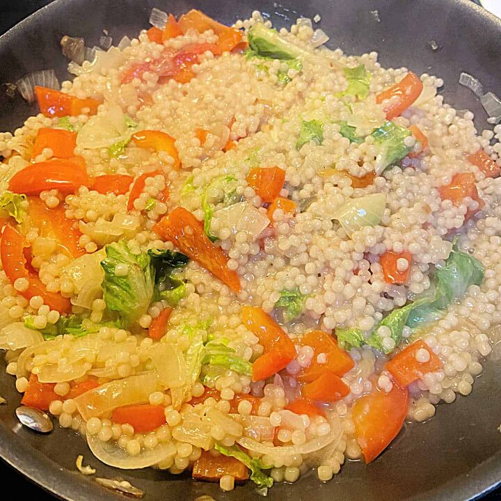 substitute for rice in risotto pearl couscous, Pearl couscous in a frying pan with red pepper and spinach