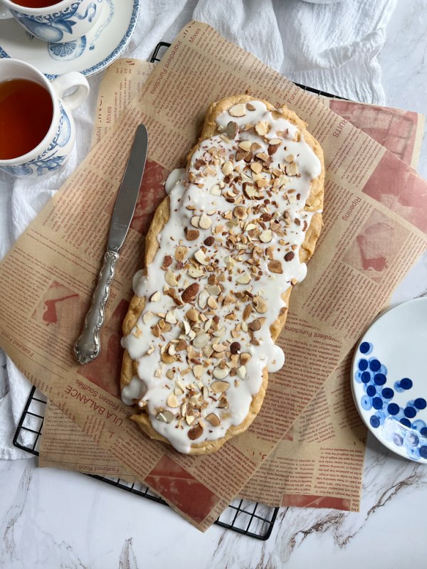 almond kringle, Swedish Kringler Almond Puff on a brown paper with a cup of tea
