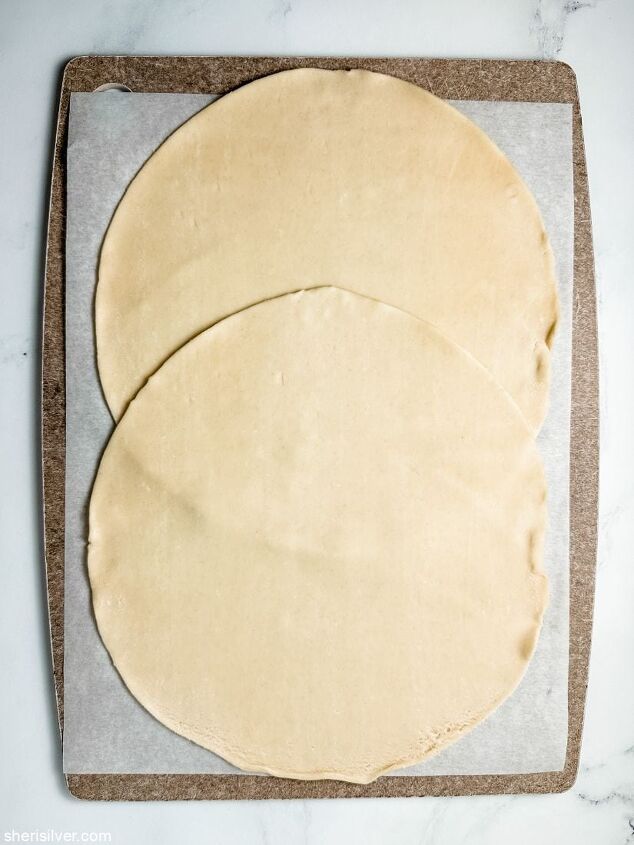 brown sugar slab pie sheri silver, two round pie crusts on a sheet of parchment paper