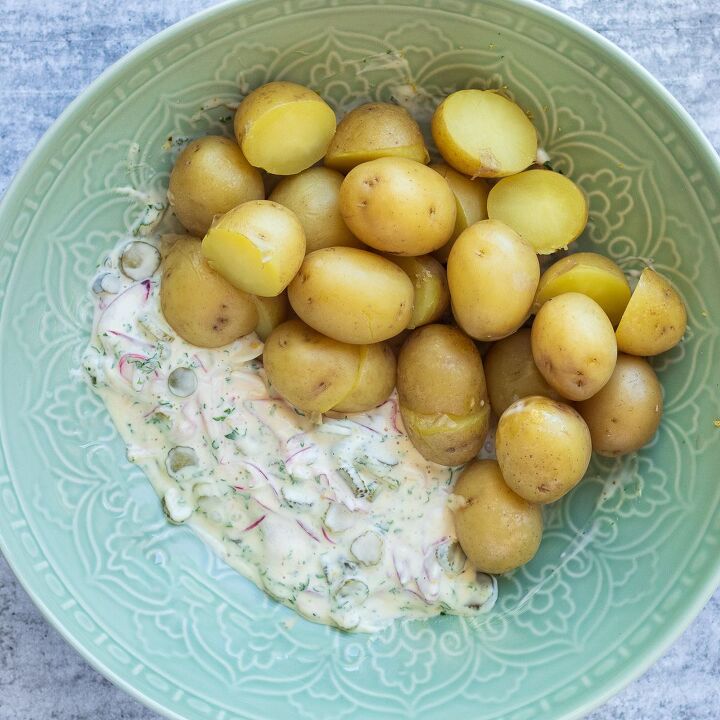 smoked salmon potato salad recipe, Potatoes and salad dressing ingredients in bowl ready to mix