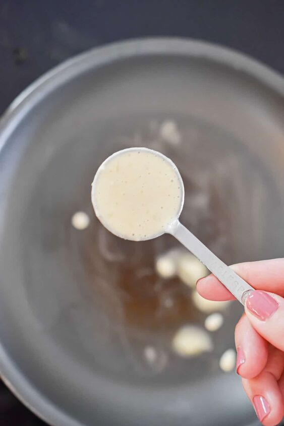silver dollar pancakes mini pancakes, The silver dollar pancakes batter is in a tablespoon over the saute pan