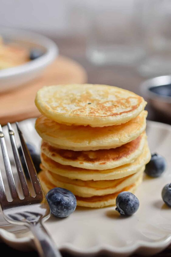 silver dollar pancakes mini pancakes, A stack of silver dollar pancakes without any maple syrup on it