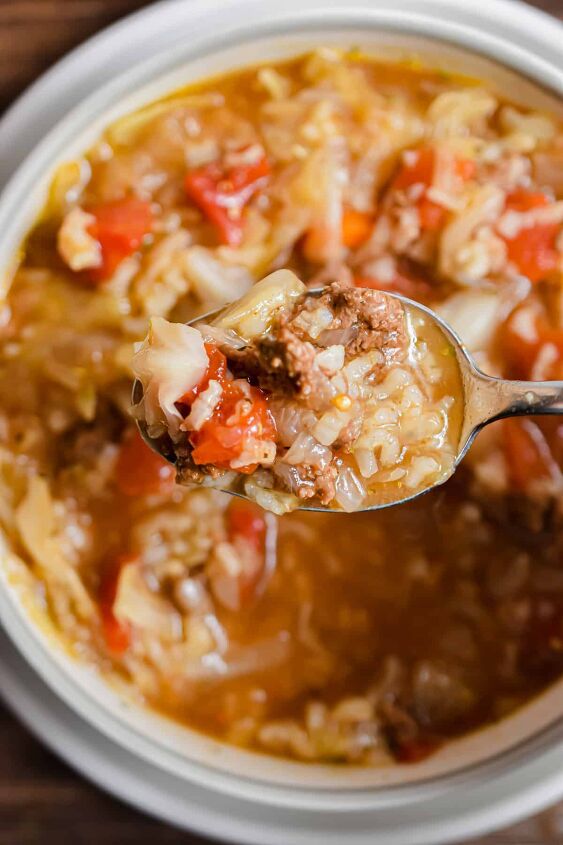 instant pot cabbage roll soup, A spoon is lifting the Instant Pot Cabbage Soup