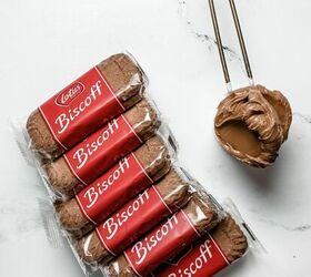 stack of biscoff cookies next to a measuring cup filled with biscoff spread