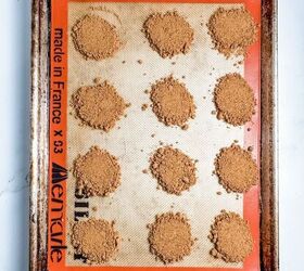 crushed biscoff cookie circles on silpat lined baking sheet