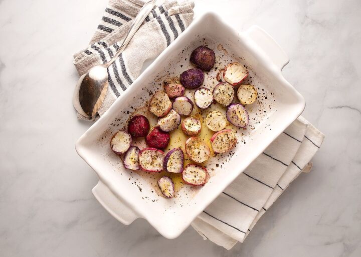 roasted herbed radishes, a baking pan of roasted herbed radishes