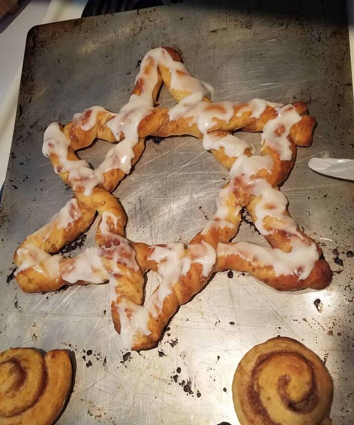 the easiest ever patriotic cinnamon roll star, melted frosting on baked star