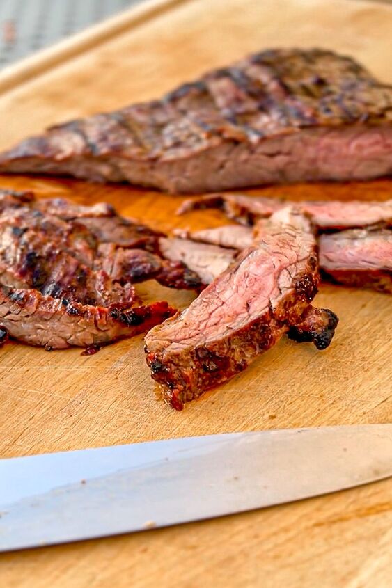 the best grilled steak ever, Sliced steak on a cutting board