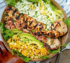 grilled chicken salad, overhead shot of grilled chicken salad with plates nearby
