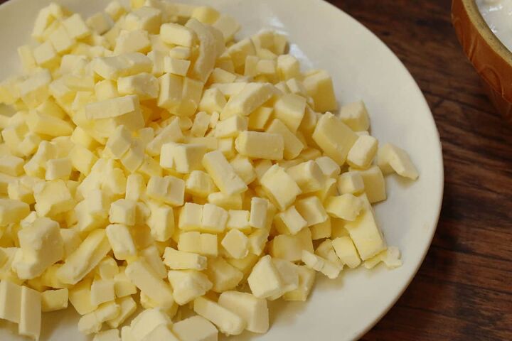 butterhorn recipe with cottage cheese, A white plate with cubed butter