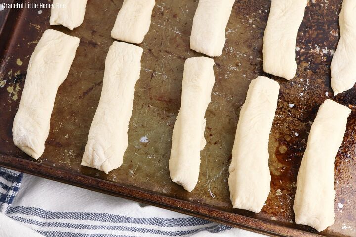 copycat olive garden bread machine breadsticks, Bread sticks on baking sheet before going into the oven
