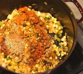 dutch oven white chicken chili, Corn and seasoning added to a Dutch oven of chicken chili