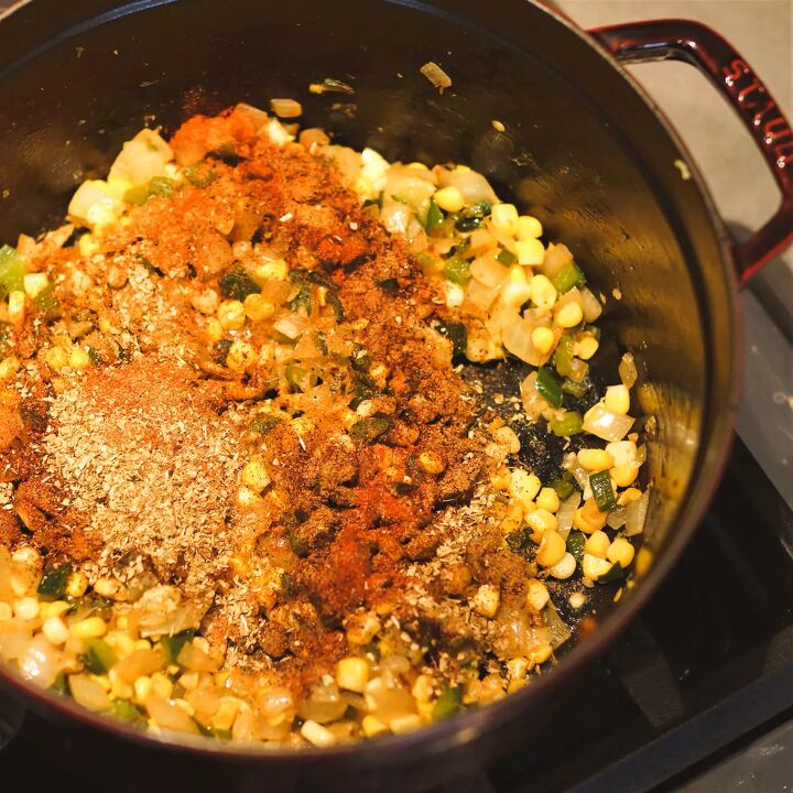 dutch oven white chicken chili, Corn and seasoning added to a Dutch oven of chicken chili