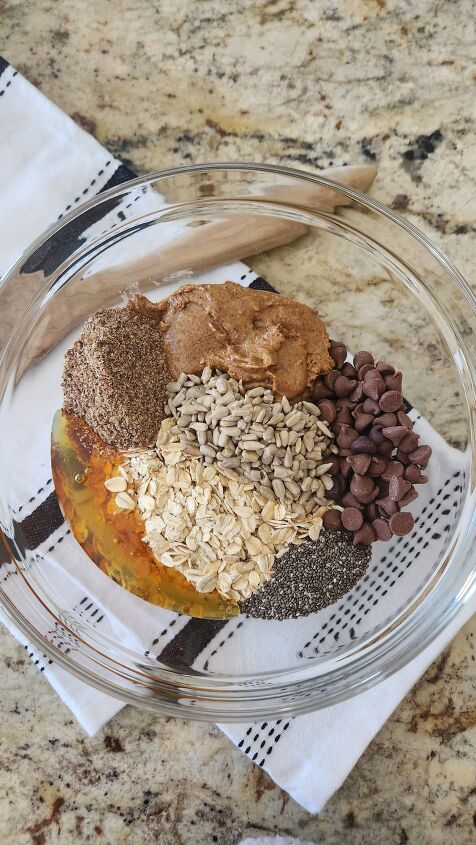 easy healthy snack almond butter protein ball recipe, Add all ingredients to your mixing bowl and stir with wooden spoon