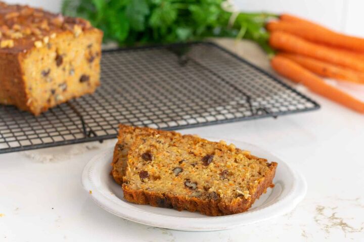 carrot bread recipe, Sliced Carrot Bread on a colling rack with fresh carrots in the background