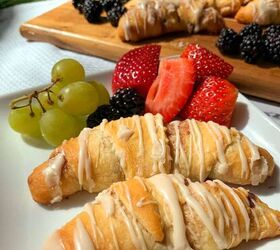 crescent roll cinnamon rolls, A white plate with crescent rolls on it along with strawberry blackberries and grapes