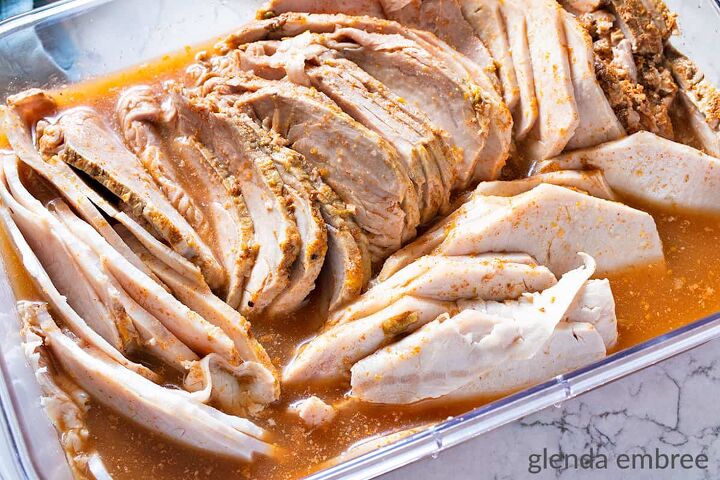 slow cooker pork carnitas, Slow Cooker Pork carnitas roast sliced thin and stored in its cooking liquid in a clear rectangular container with no lid