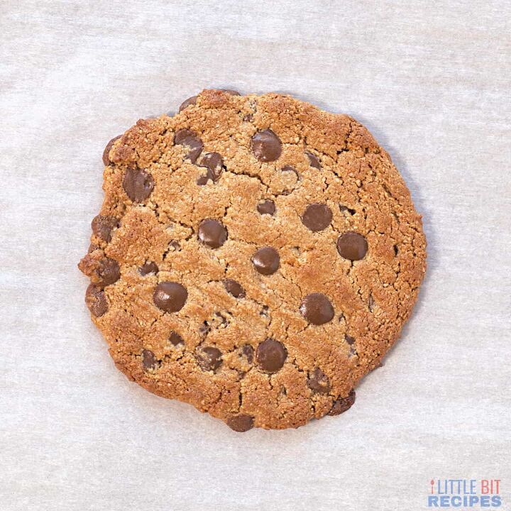 healthy single serve cookie vegan, baked cookie on parchment paper lined pan