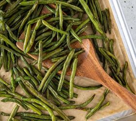roasted frozen green beans, A parchment lined tray of roasted green beans with a spatula