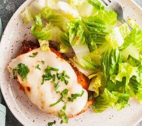 easy air fryer chicken parmesan, Overhead view of chicken parm plated with a green salad