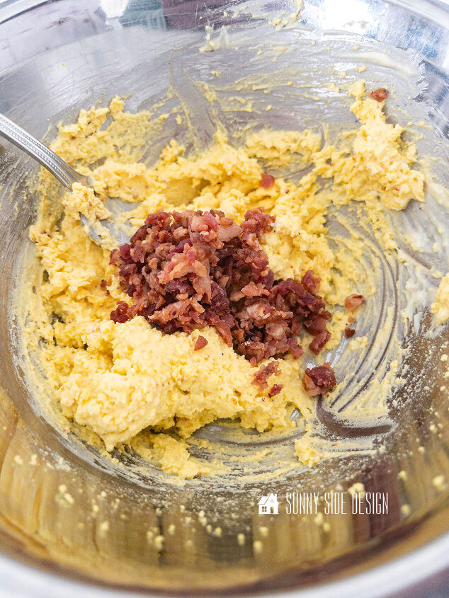 Add bacon to egg yolk mixture