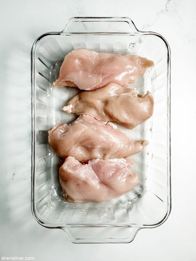 perfect oven baked chicken breasts, boneless chicken breasts in a glass baking dish
