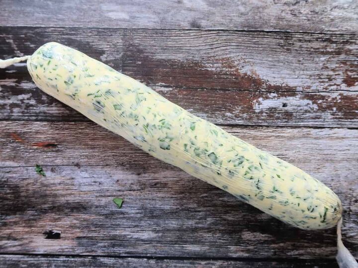 easy wild garlic butter recipe with a secret ingredient, homemade wild garlic butter rolled in a sausage shape and wrapped in cling film