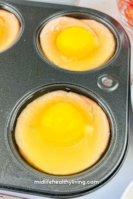 weight watchers egg cups, raw eggs in a muffin tin