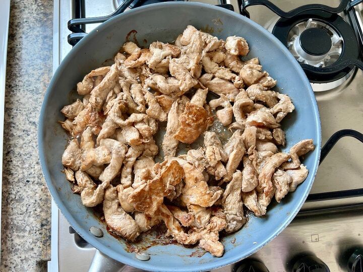 marinated chicken stir fry with pineapple and beans, Cooked chicken strips in a skillet on stove for Marinated Chicken Stir Fry recipe