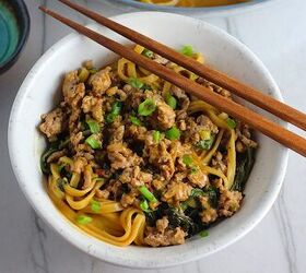 ground chicken dan dan noodles easy recipe, Dan Dan Noodle Recipe with Ground Chicken in a bowl Chopsticks are sitting on top and scallion slices are on top