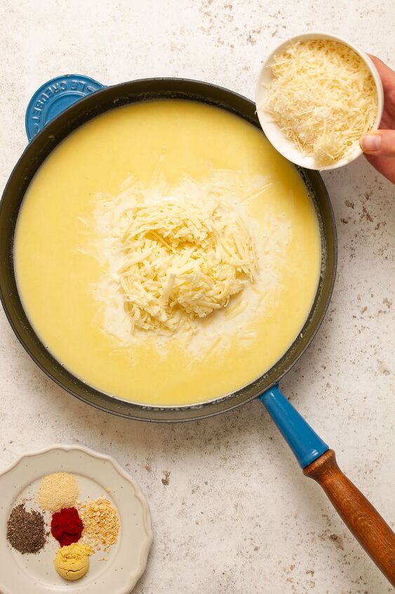 seriously cheesy pasta bake, Adding the milk cheese and seasoning
