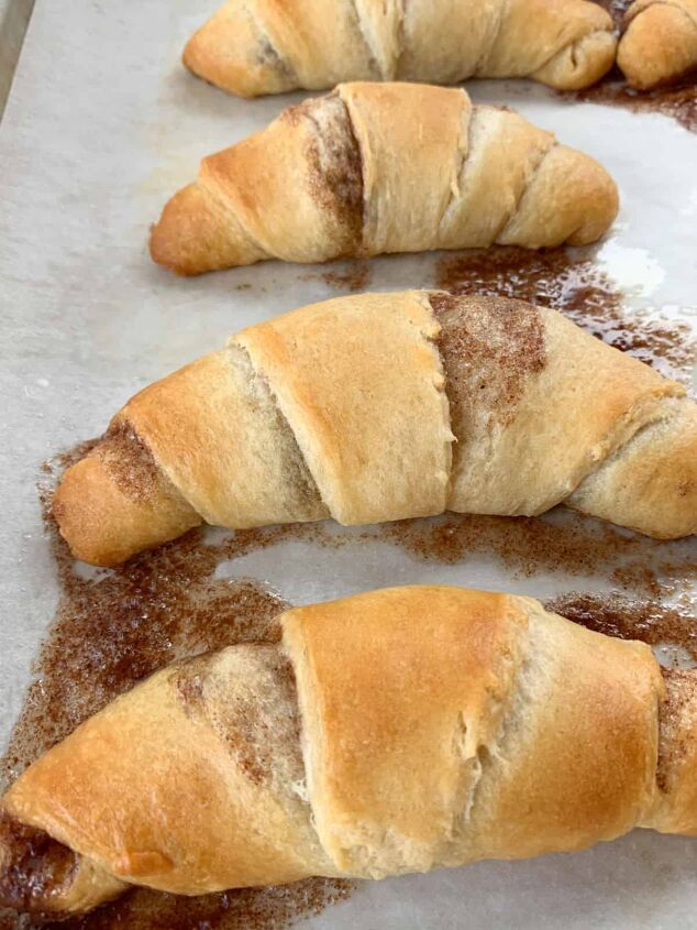 crescent roll cinnamon rolls, Baked crescent rolls on a baking sheet showing cinnamon that baked out