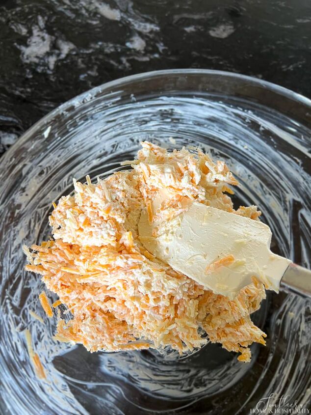 southern pimento cheese ball easy masters party favorite, Stirring cream cheese mixture with grated cheese