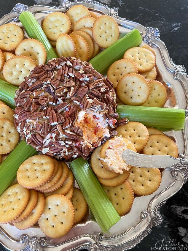 southern pimento cheese ball easy masters party favorite, Spreading pimento cheese on cracker