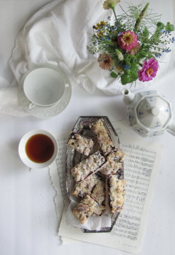 roasted cherry streusel shortbread cookie bars, flatlay browned butter roasted cherry shortbread bars with flowers and tea 2