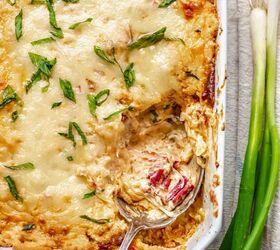 hot corned beef reuben dip, A spoon rests in a casserole dish with dip on it