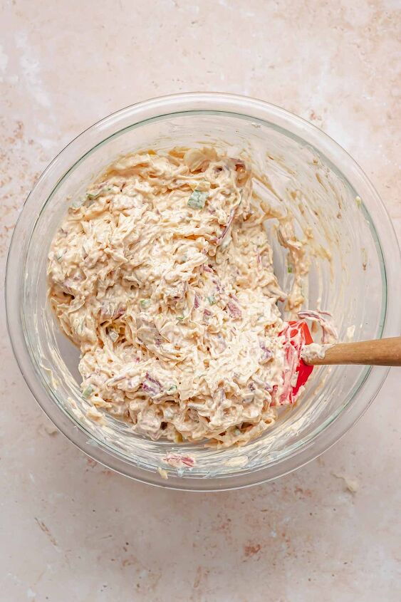 hot corned beef reuben dip, All dip ingredients mixed together in a bowl with a rubber spatula