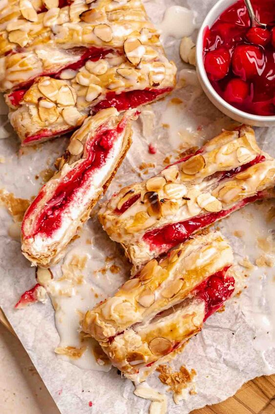 cream cheese cherry danish with puff pastry, Sliced cherry danish on a cutting board