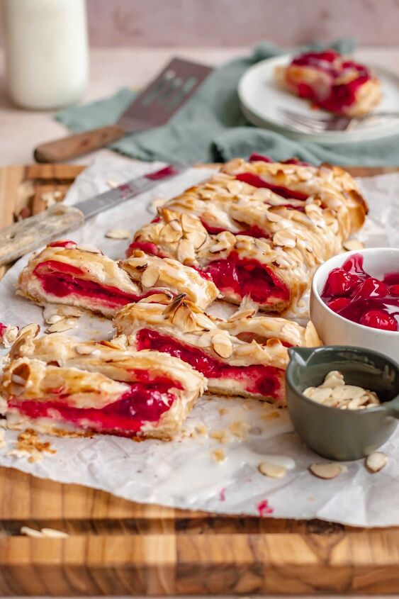 cream cheese cherry danish with puff pastry, Sliced cherry danish on a cutting board