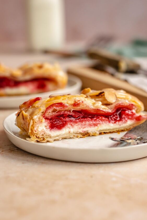 cream cheese cherry danish with puff pastry, A slice of cream cheese danish on a plate