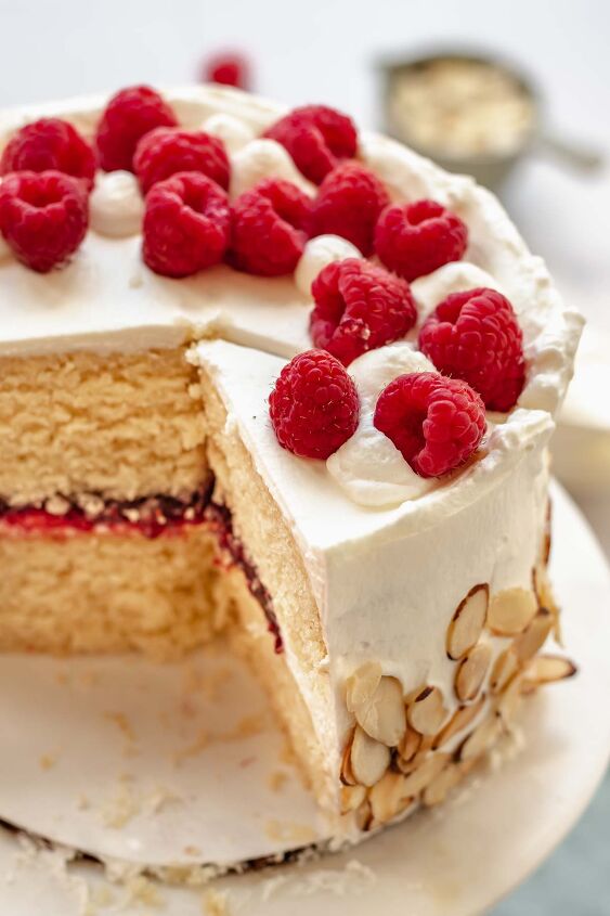 raspberry and almond cake, Raspberry almond cake on a platter with some slices removed